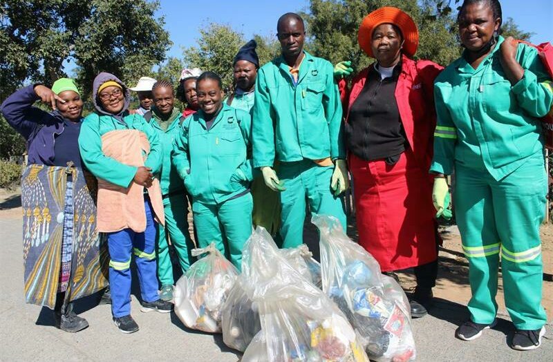 Another group of Alexandra Water Warriors volunteers shows excitement as they tidy the streets of Alex. Photo: Xoliswa Zakwe