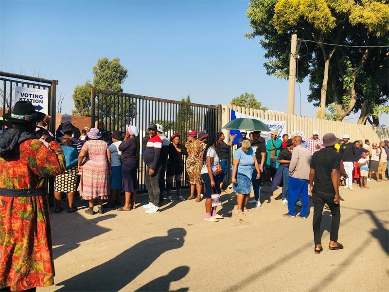 Residents queue outside the premises at the 3rd Avenue Library voting station. Photo: Xoliswa Zakwe