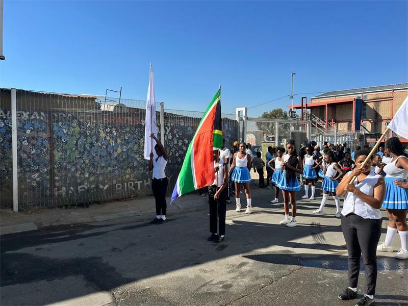 Marchers carry the South African flag demanding an end to social and economic inequalities that continue to plague the country.