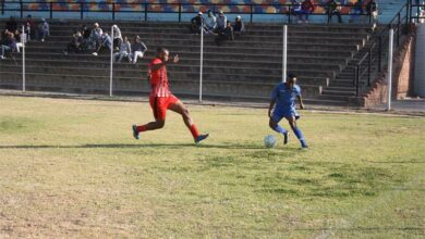 Black Masks gangling defender Joshua Dube (red) tries to end dangerous goal moves by an Alex Royal Tigers winger.