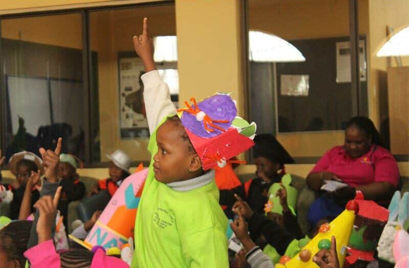 Alexandra’s children transform recycled cardboards into colourful, one-of-a-kind hats for a lively parade at the Children's Library on 3rd Avenue.