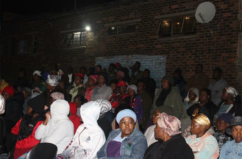 The community gathered on 24th-6th Avenue for a candle-lighting ceremony held for Simon Phalama, whose death has shocked the whole community.