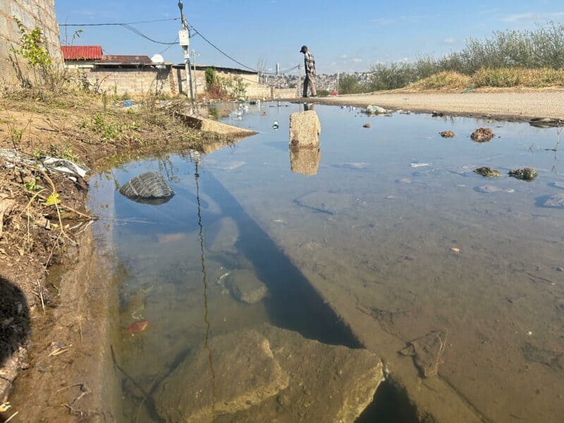 Three months after residents reported a persistent water leak, Martin Manzi Street remains flooded.