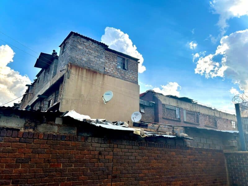 A daughter walked into her mother’s home only to find her body lying on the floor and an intruder allegedly hiding behind the door.