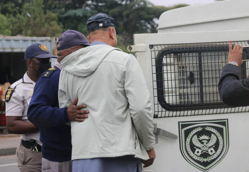 A foreign national is detained by an immigration officer after he fails to furnish city officials with information pertaining to the South African national, he alleges to have married, near Pan Africa Shopping Centre on November 4, 2025. Photo: Itumeleng Maloka