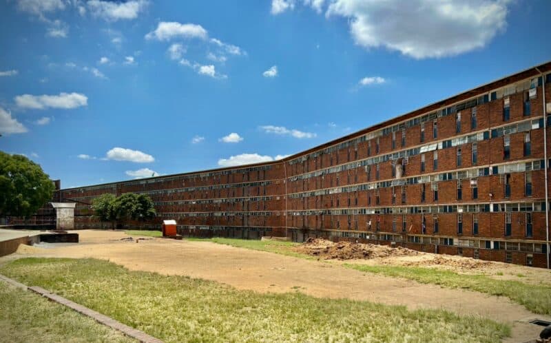 The sewer reticulation project at Helen Joseph Women’s Hostel is addressing long-standing sanitation issues, but residents say leaking roofs, broken sinks, and unreliable water supply continue to make life difficult for residents.