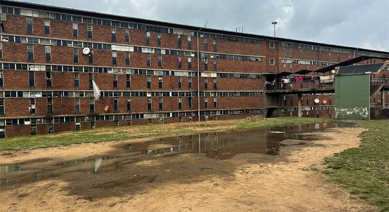 Helen Joseph Hostel’s multimillion-rand pipeline project crawls forward, as sewage, sand theft, and stalled payments muddy the path to progress.