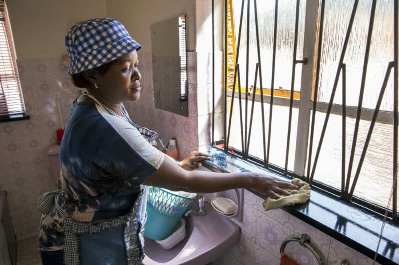 Lucy Mokhele carries out her physically demanding duties, which involve cleaning and cooking for her elderly employer and other family members in a private home in Johannesburg. Photo: Supplied