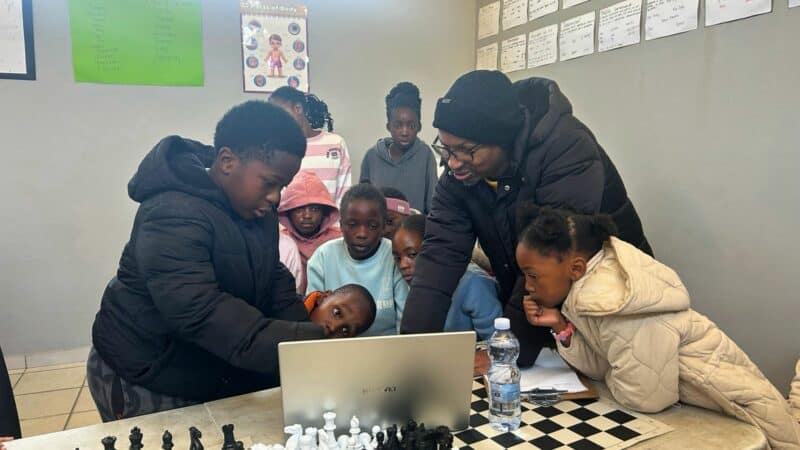 Founder of Chess Is My Lifestyle, Bongani Mazibuko shows children in Alexandra how to play chess at Kwabhekilanga Sports Ground on July 2, 2026. Photo: Itumeleng Maloka