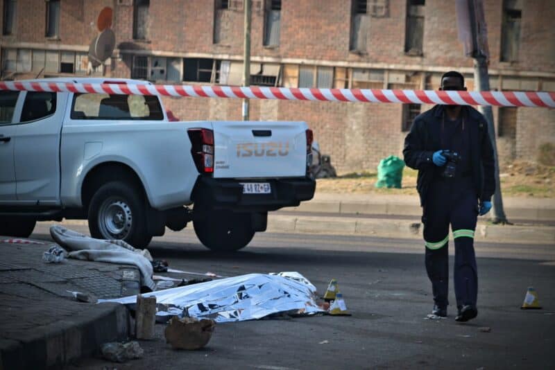 Police investigate a murder case after a man was discovered dead with gunshot wounds on his upper body in Alexandra on July 13, 2026. Photo: Itumeleng Maloka