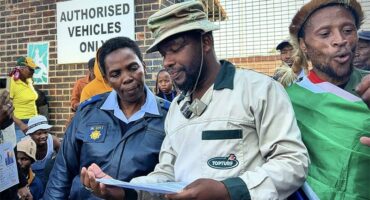 After hours of marching through the streets of Alexandra, protesters finally handover a memorandum of demands to the local police officers in Alexandra on June 30, 2026. Photo: Itumeleng Maloka