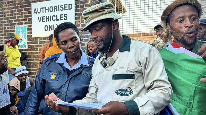 After hours of marching through the streets of Alexandra, protesters finally handover a memorandum of demands to the local police officers in Alexandra on June 30, 2026. Photo: Itumeleng Maloka
