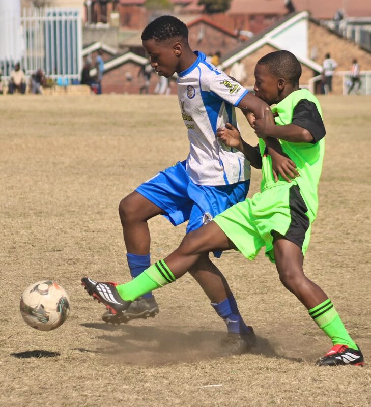 Alex Royal Tigers’ Inam Gcolotela tries to retain possession of the ball but Alex Winter Rose’s Bandile Ndaba fights to win it during their clash at the Altrec Sports Complex in Alexandra on August 2, 2026.