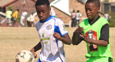 Alex Royal Tigers’ Inam Gcolotela tries to hold on to the ball with Alex Winter Rose’s Bandile Ndaba trailing close during their match at Altrec Sports Complex on August 2, 2026.