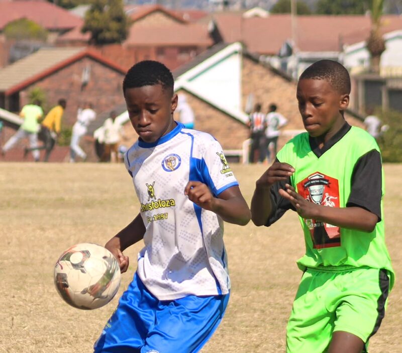 Alex Royal Tigers’ Inam Gcolotela tries to hold on to the ball with Alex Winter Rose’s Bandile Ndaba trailing close during their match at Altrec Sports Complex on August 2, 2026.