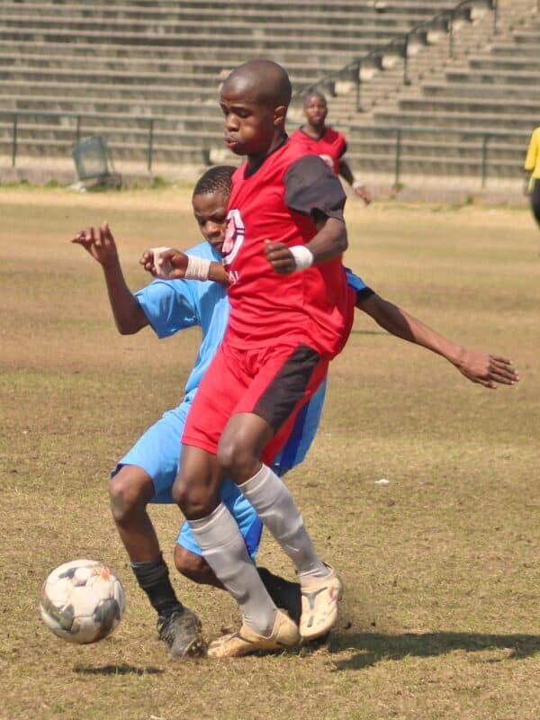 Mighty Heroes FC player Thembalethu Ntsele tries to seize possession from Super Stars FC player Lufefe Daniel at 3Square Sports Ground in Alexandra on August 9, 2026. Photo: Itumeleng Maloka
