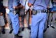 Police officers search learners at Realogile Secondary School in Alexandra. Photo: The Gauteng Department of Education/Facebook