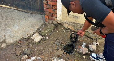 Ward 81 activist Theo Lengwati traces water trickling on Mapane Road to a leaking meter in River Park on August 31, 2026. Photo: Itumeleng Maloka