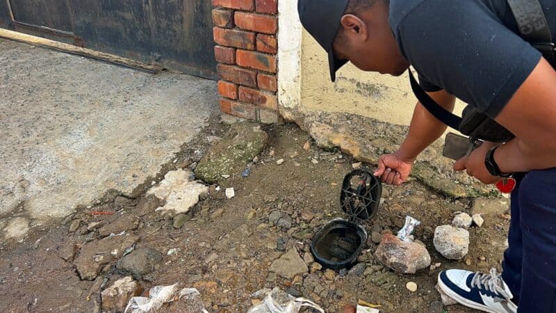 Ward 81 activist Theo Lengwati traces water trickling on Mapane Road to a leaking meter in River Park on August 31, 2026. Photo: Itumeleng Maloka