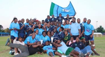 : Alex Wolves players and coaches celebrate after winning the Senior Grand Challenge titles in Ridgeway on September 12, 2026.