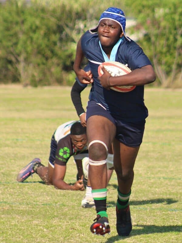 Alex Wolves’ Luthando Ndara pushes forward with the ball even as he is about to be tackled by a Harlequins players during their match at Ridgeway on September 12, 2026.