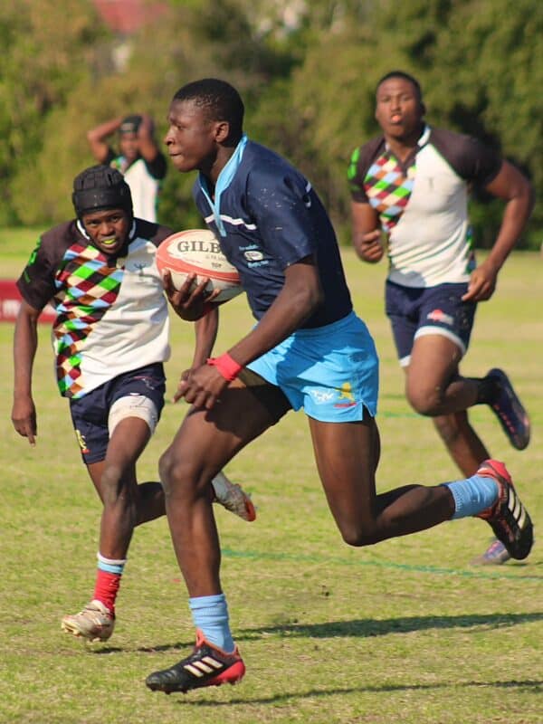 Pilot Chabalala, Alex Wolves player, runs towards Harlequins posts after gaining possession of the ball during their match in Ridgeway on September 12, 2026.