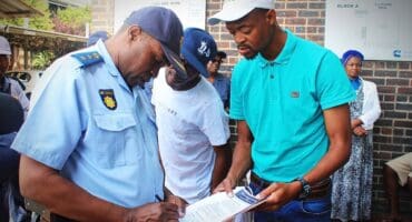 Visible Policing Commander Colonel Jerry Phaswana signs residents’ memorandum of demands in Alexandra on October 11, 2026.