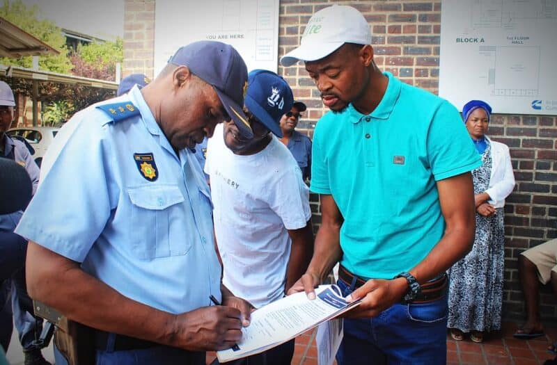 Visible Policing Commander Colonel Jerry Phaswana signs residents’ memorandum of demands in Alexandra on October 11, 2026.