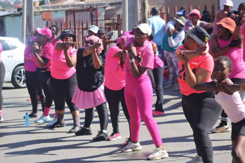Alexandra residents stretch after participating in an intense aerobics session at KwaDlozi Car Wash in Alexandra on October 24, 2026. Photo: Itumeleng Maloka