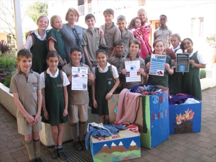 Mrs Sharon Forsyth with her grade 5 LEAP Class and some of their winter warmth collections.