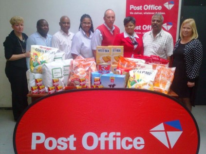 Area Manager Petro Barnard, and the staff at Port Natal Area (Durban) of the Post Office handing over their gift to Cheryl Rundle, PRO/Fundraiser for Ethelbert.Photo provided.