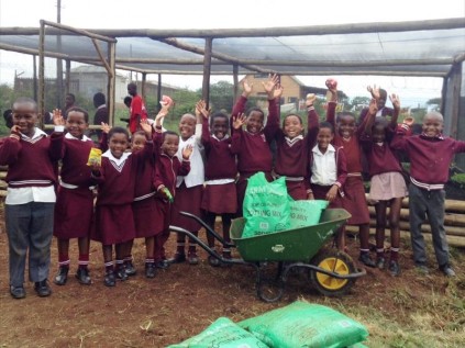 The learners of Empilweni Primary School celebrating after learning how to plant their own veggies.