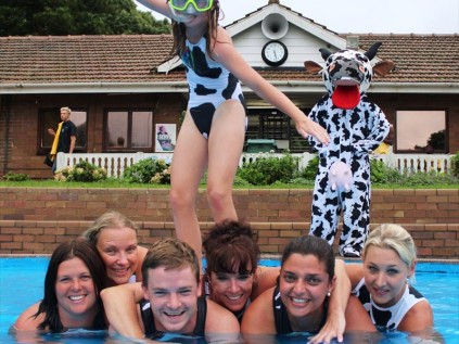 Julia Varty (standing) and Lauren Varty (Cow), in the water are Taryn Curtis, Rose Owen, Robert and Iris Varty, Lynne Macrae and Lauren Brown. Photo:Kim Joubert Photography