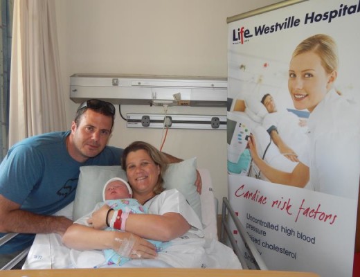 Gary and Emma Honneysett pose for a pic with their new addition to their family, Michael,