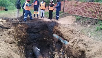 Ocversight visit by MEC of Environment, Commerce and Tourism seen discussing the broken pipe underground with Spill Tech staff on site in Bellair