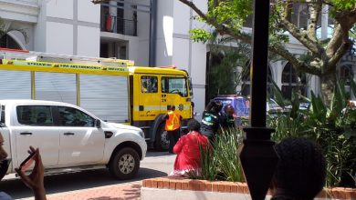 Front roadside entrance to the pavilion shopping center with fire engine and partially obscured ambulance
