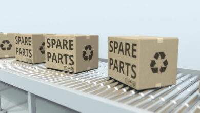 Cartons with spare parts on roller conveyor. 3D rendering