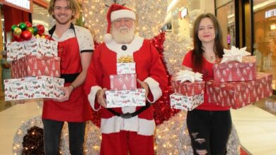St Martins Children's Home volunteers - Christopher Holmes and Kaylee Aitken with Eddie Locke (Santa)..
