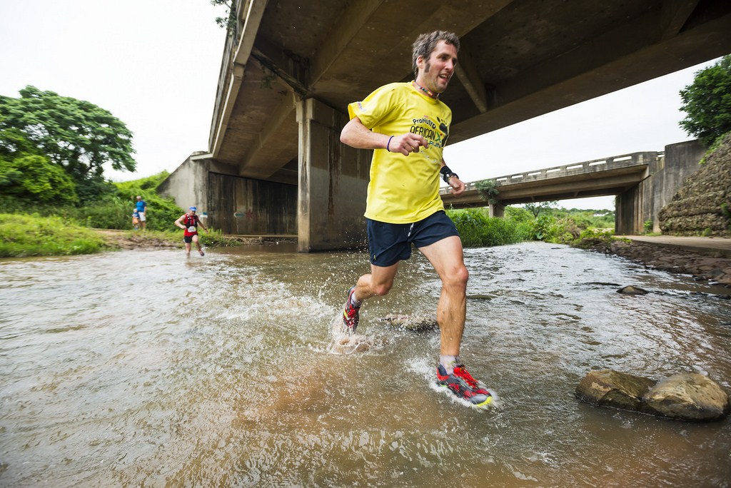 Winning gent and UK tourist, Al Lesli flies through the water crossing on his way to his first win in the uMhlanga Liberty Trail Run and Walk 18km. PHOTO: Antony Grote