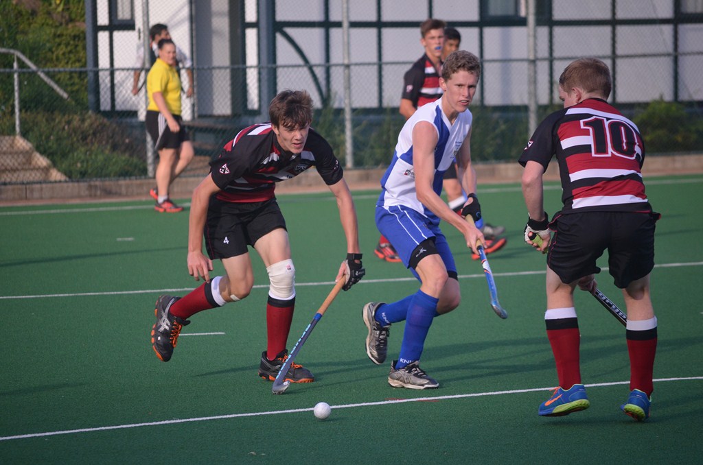 Northwood Hockey captain Gregory Wright tussles with the Thomas More College defenders. He scored the only game of the match to secure his team’s first victory of the season.