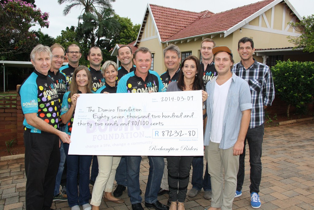 A group of Durban North cyclists helped raise R87 232 for the Domino Baby’s Home at the Cape Argus Cycle Tour. They are congratulated by members of the Domino Baby’s Home.