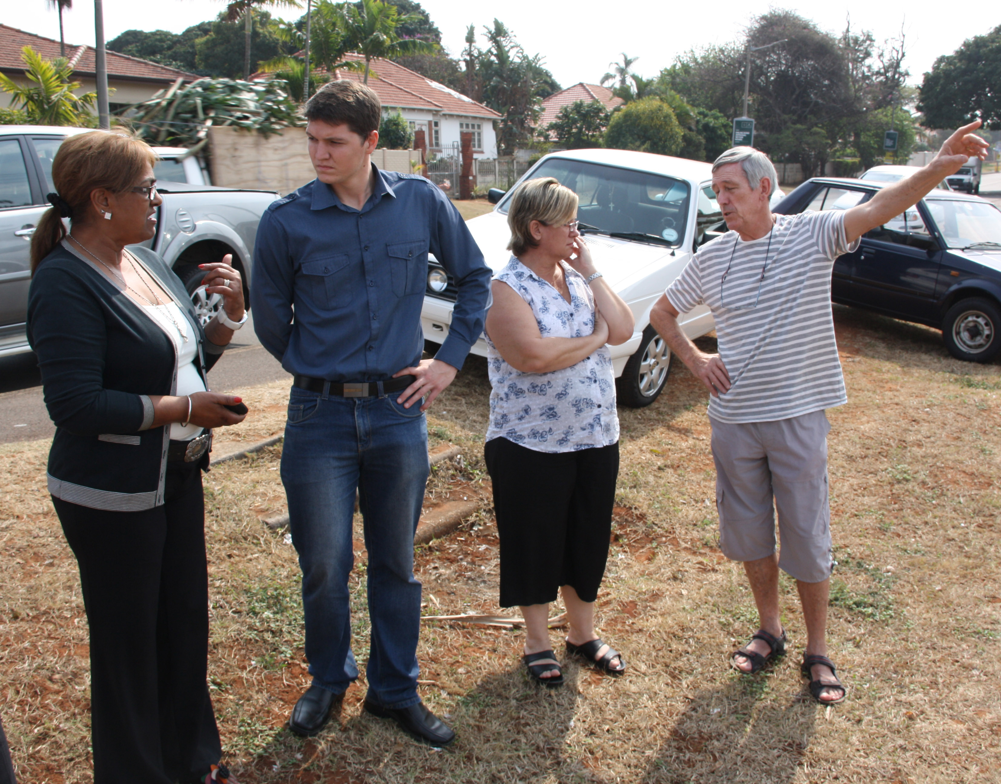 Angry residents Maggie Farrell, Angela Lourens and David Williams speak to Durban North ward councillor Shaun Ryley (second from left) about their concerns over a vacant piece of land now home to several vagrants.