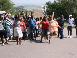 Protesters have been singing struggle songs as they await Sibaya Casino management.