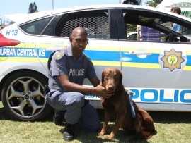 Constable Vasu Soobramoney with Ian, the narcotics dog, from the Durban K9 Unit.