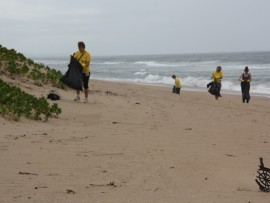 Some residents combed the beach around the mangroves looking for discarded trash.
