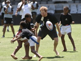 Prince Harry's team lost by five tries to two in a game of tag rugby at the Shark tank. PHOTO: Howard Cleland