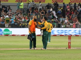 Hashim Amla and Quinton de Kock share a few words after a fall of a wicket.