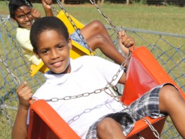 Regan November had fun on the whirly swings.