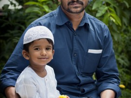 A father and son in Bangladesh celebrate Eid al Fitr.