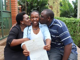 Simi-Nobukhosi Moyo, who finished with 7As is congratulated by her parents, Phiwe and Duminkosi.